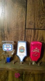 Three assorted beer taps