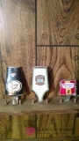 Three assorted beer taps