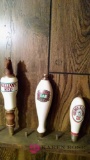 Three assorted beer taps