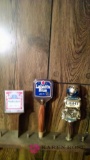 Three assorted beer taps