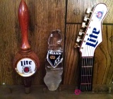 Three assorted beer taps