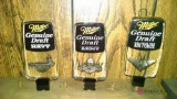 Three Miller Genuine Draft beer taps