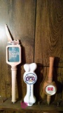 Three assorted beer taps