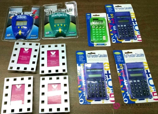 Assorted lot of handheld games, calculators, and picture frames