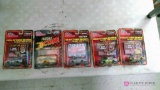 Five Racing Champions collectors series cars