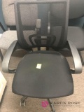Black rolling office chair with mesh back