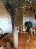 Tall vase with Peacock feathers in dining room