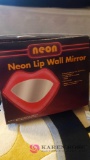 Neon lip wall mirror in B2