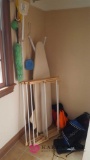 Ironing board and clothes rack in utility room