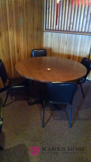51 inch round Table with folding leaves and four chairs