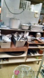 Cabinet with contents of cooking pots pans and utensils