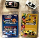 Three NASCAR cars and one other car