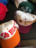 10 collectible football team hats