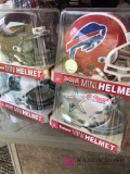 4 Collectible mini NFL helmets
