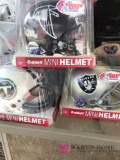 Three NFL mini helmets