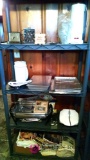 Shelf contents including Farberware rotisserie broiler, clocks, kitchen items and more