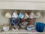 Shelf of decorative cups and plates