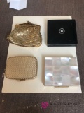 Three compact one gold colored change purse