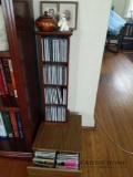 2 CD racks, CDs, figurines, and 2 pictures