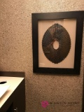 Framed art/ far back bathroom