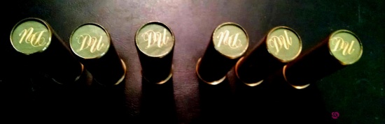 Six initialed shotgun shells