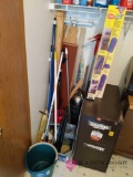 Corner lot of cleaning tools in laundry room