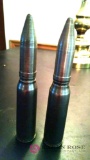 Two 5 and 1/2 inch 20 millimeter cartridges