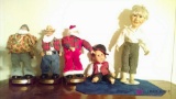 Three singing Santa's and two dolls