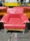 Red cushioned armchair