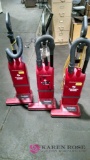 Three sanitaire commercial dual motor vacuums