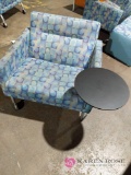 Chair on wheels with attached table