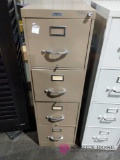 Tall brown metal file cabinet