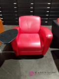 Red armchair with attached table