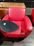 Red armchair with attached table