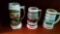 Three decorative mugs