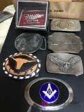 Group of seven belt buckles