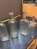 Vintage medicine and whiskey bottles