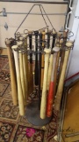 Baseball wooden bats and antique metal rack