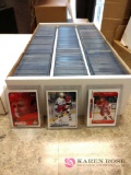 Collection of hockey player trading cards sleeved