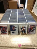 Collection of hockey player trading cards sleeved