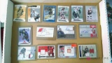 Assorted autographed hockey player cards including Jersey cards