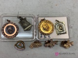 Assorted charms and awards