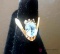 Ladies 14 karat gold ring with blue stone