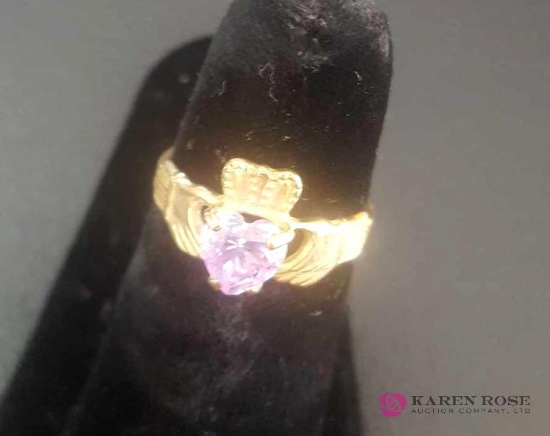 Ladies 10 karat gold ring with purple stone