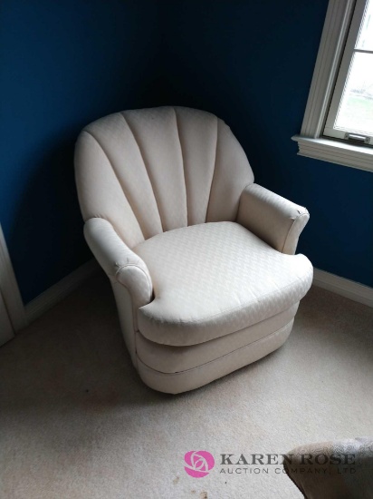 Upholstered swivel and rocking chair