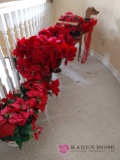 Five artificial poinsettia plants upstairs