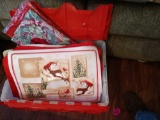 Tote full of holiday placemats and table cloths