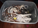 Tote full of extension cords and power supplies