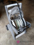 Garden hose caddy with hose