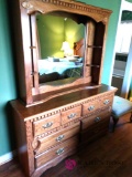 Four pieces of bedroom furniture two dressers and two nightstands,and hutch mirror